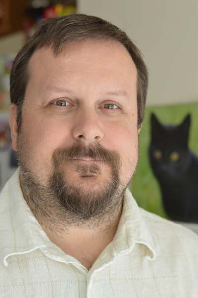 Mike's portrait along side another portrait.